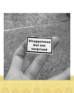 استيكر "disappointed but not surprised"