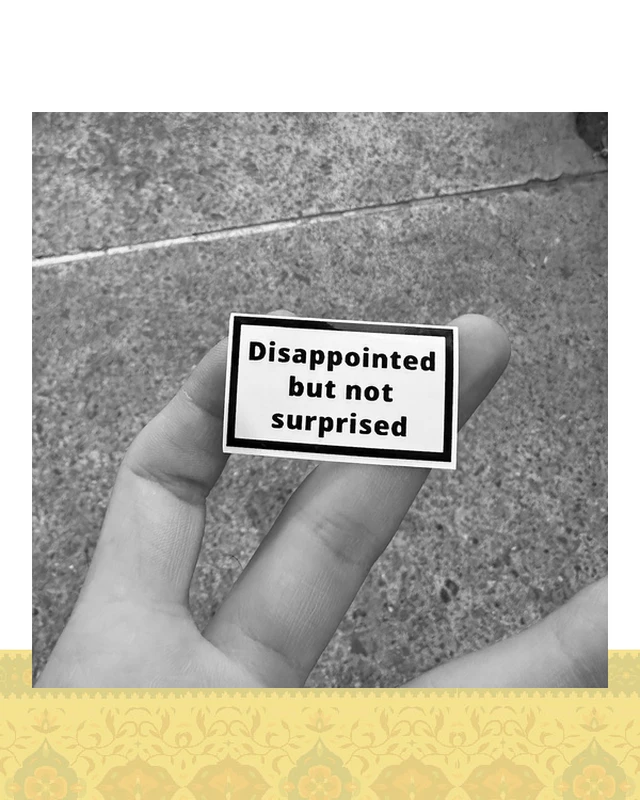 استيكر "disappointed but not surprised"